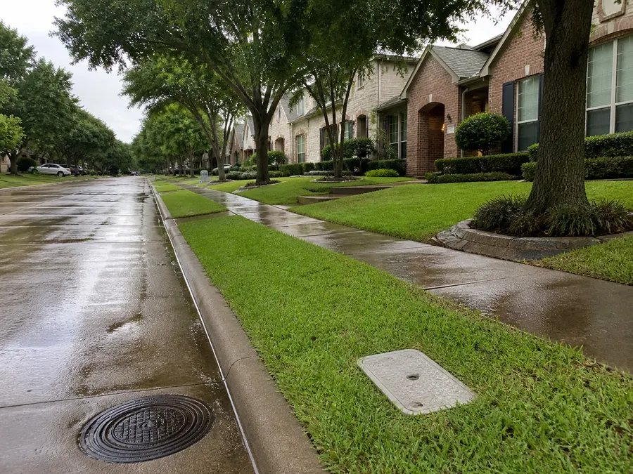Residential street and water meter for plumbing service in Prosper, Texas